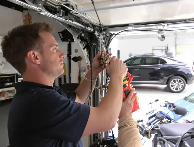 Savannah Garage Door Repair safety certified technician performing cable replacement in Savannah