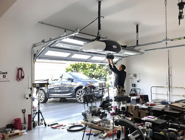 Savannah Garage Door Repair specialist installing smart garage door opener system in Savannah home