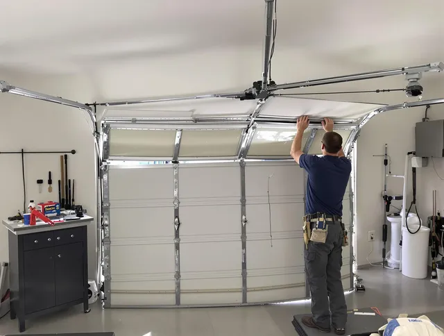 Savannah Garage Door Repair specialist performing precise section replacement on Savannah garage door